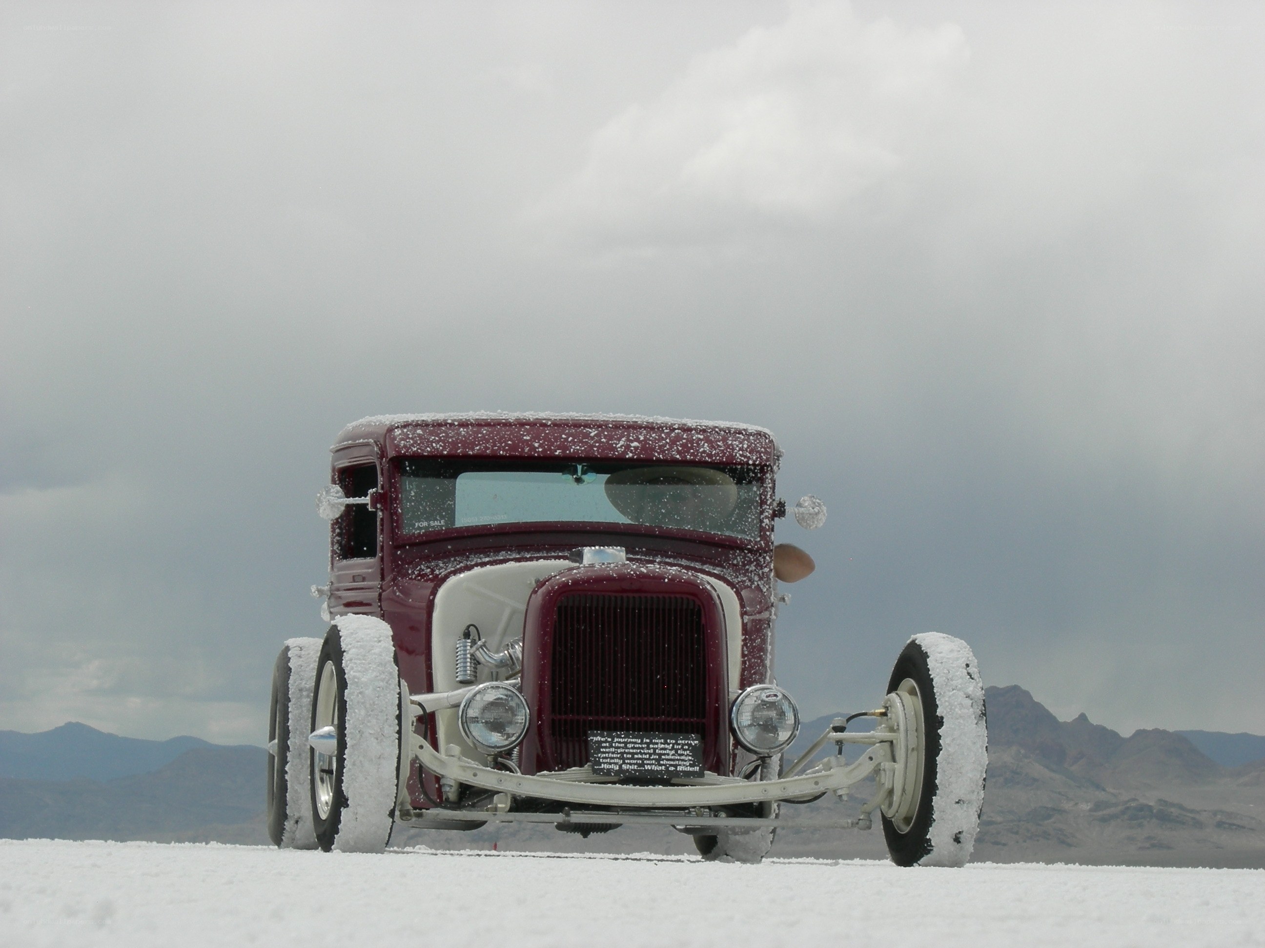 Maroon hot rod on salt flat