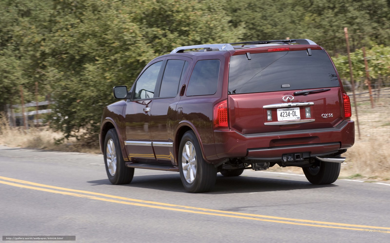 maroon infiniti qx56 on road