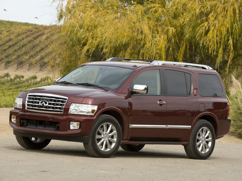 maroon infiniti suv on road