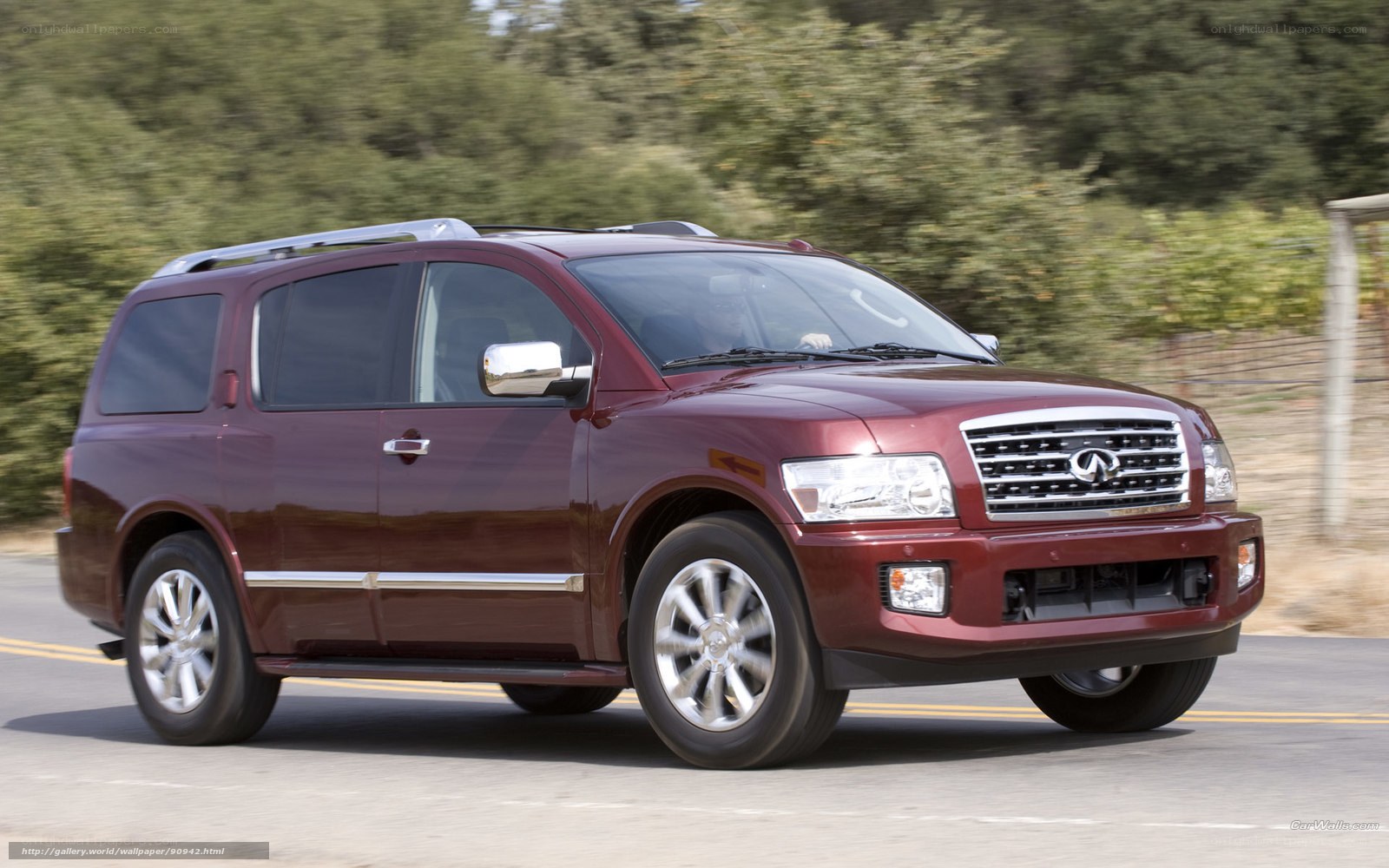 maroon infiniti suv on road