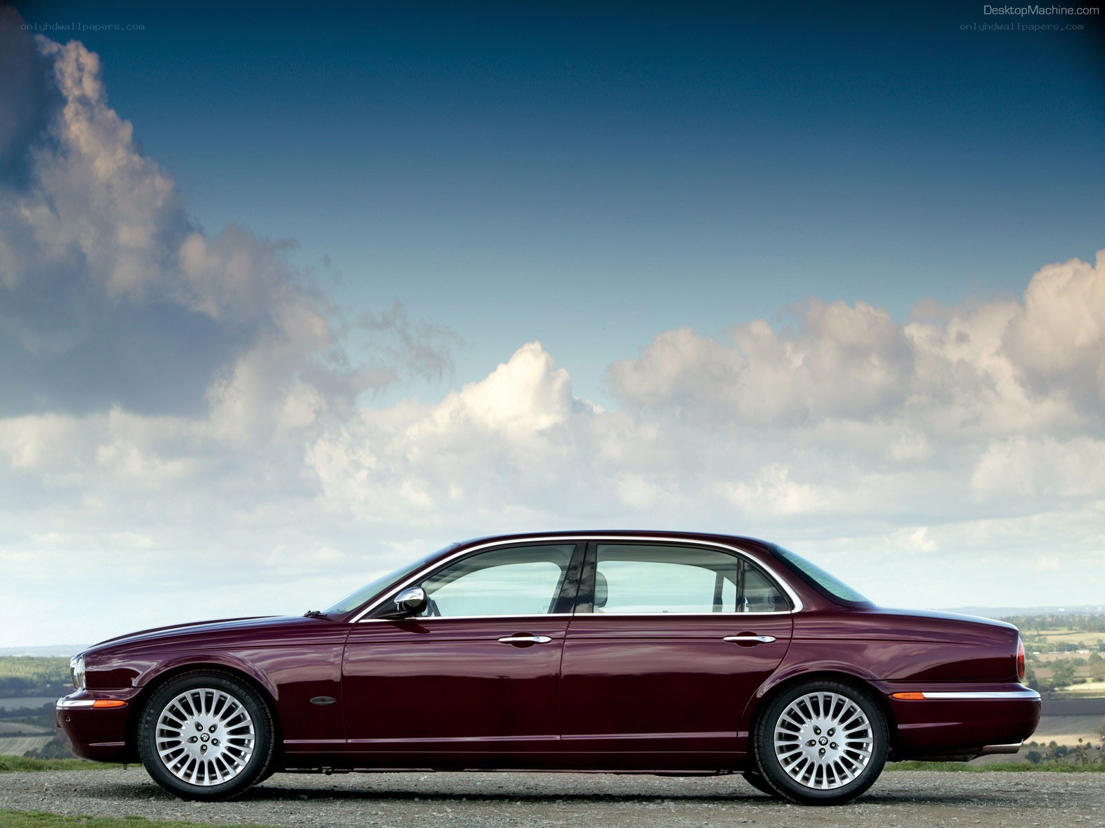 Maroon Jaguar XJ sedan