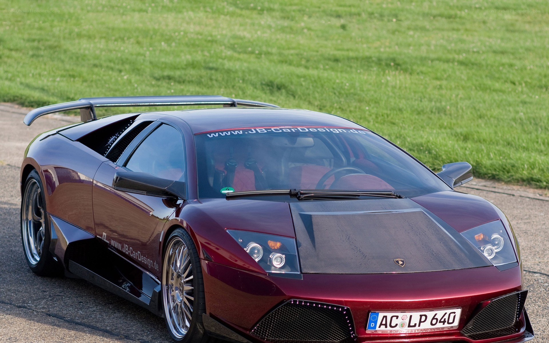 Maroon Lamborghini with custom body kit