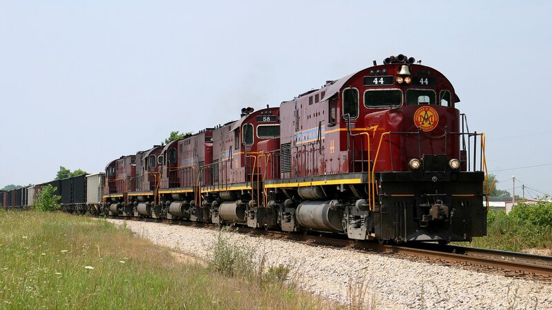 Maroon Locomotives on Track — Red