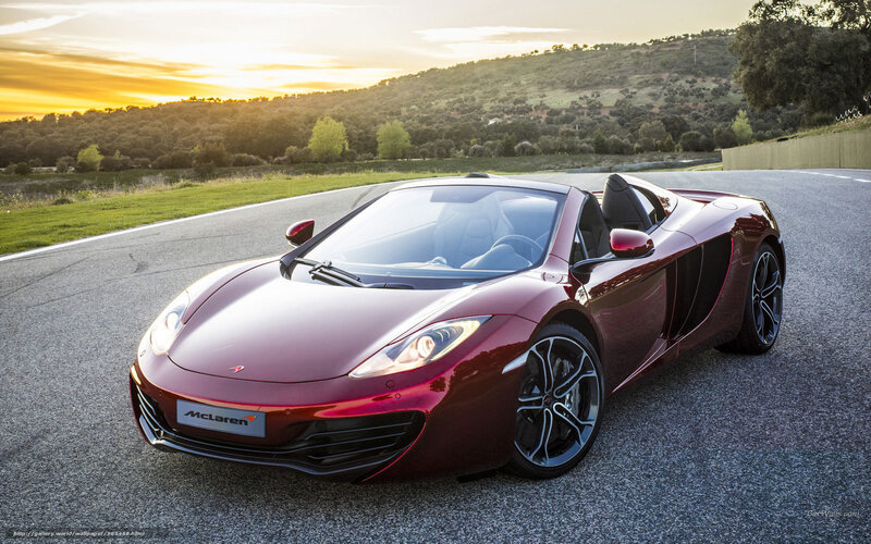 Maroon McLaren on a winding road