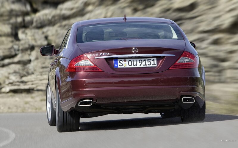 Maroon Mercedes-Benz CLS driving