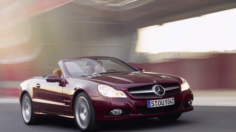 Maroon Mercedes-Benz SLK driving