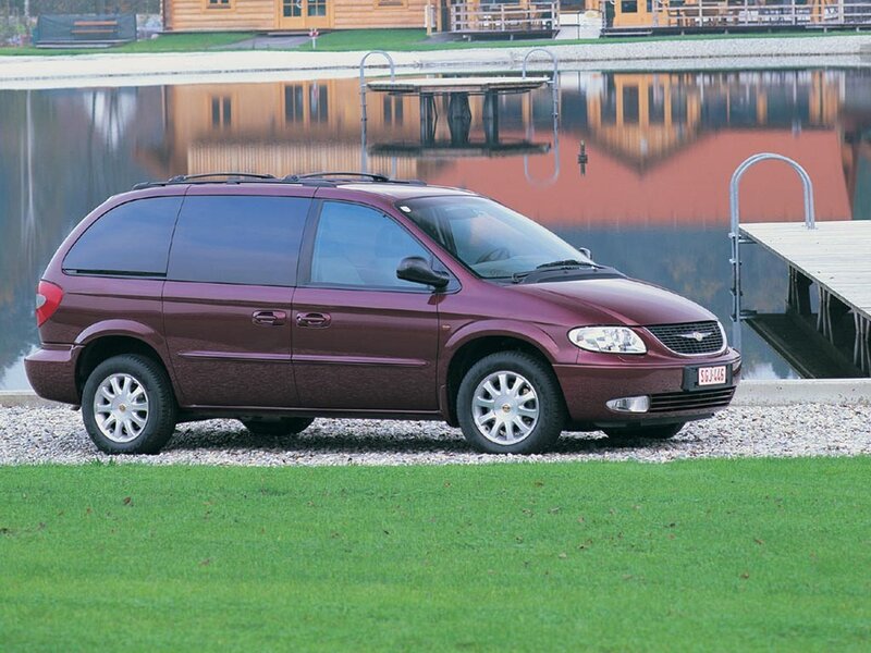 Maroon minivan by a lake