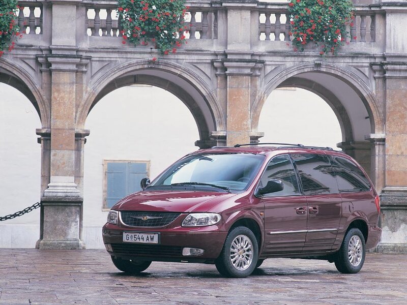 Maroon minivan in courtyard
