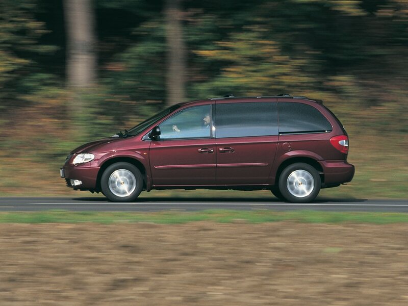 maroon minivan in motion