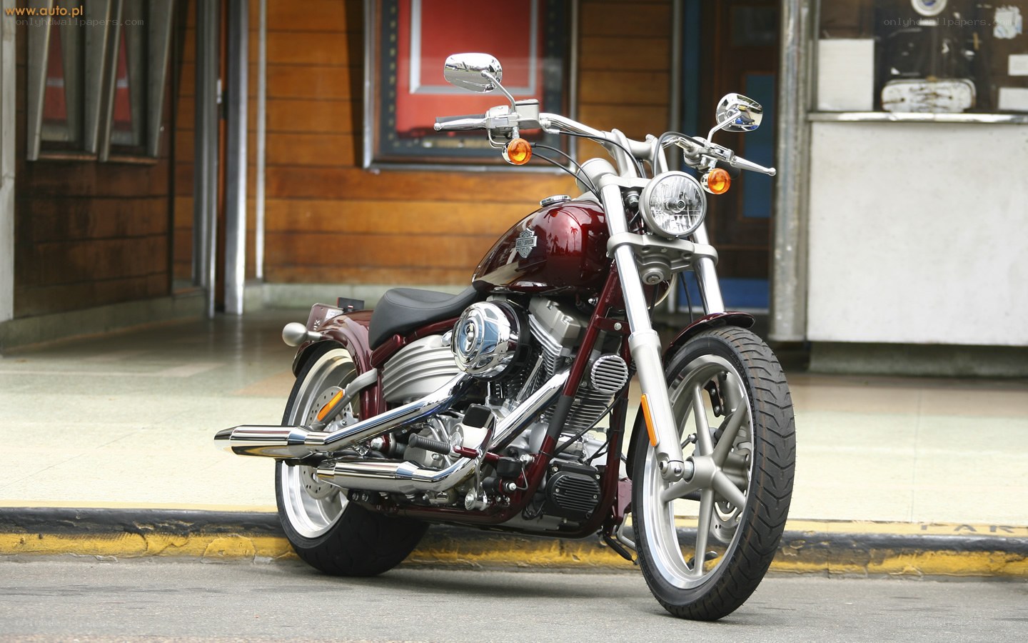 Maroon motorcycle on street