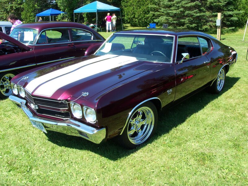 Maroon muscle car at a show