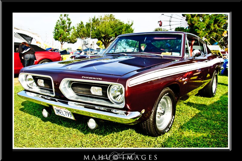 Maroon Plymouth car at a show