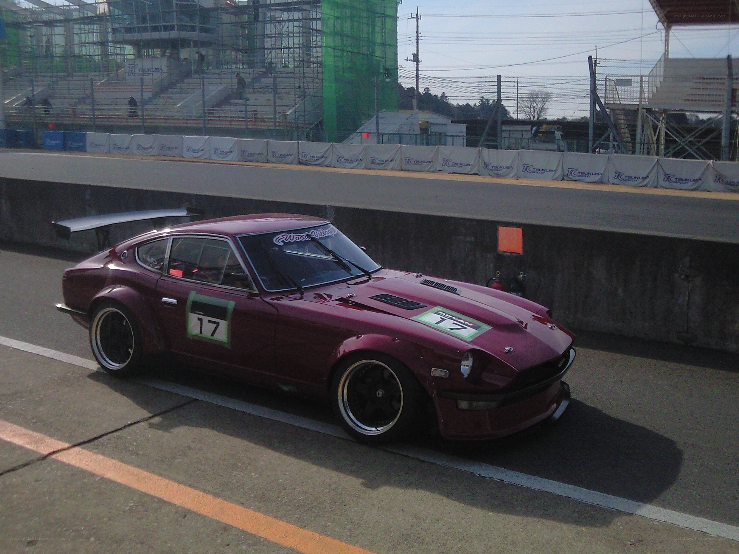 Maroon race car on track