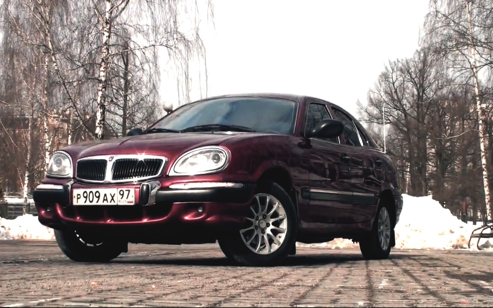 Maroon sedan in winter