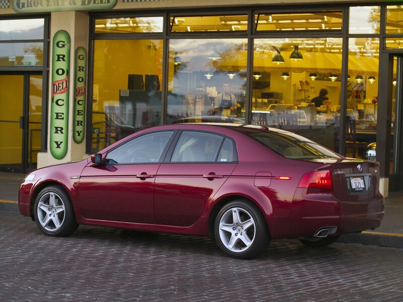 Maroon sedan outside grocery store