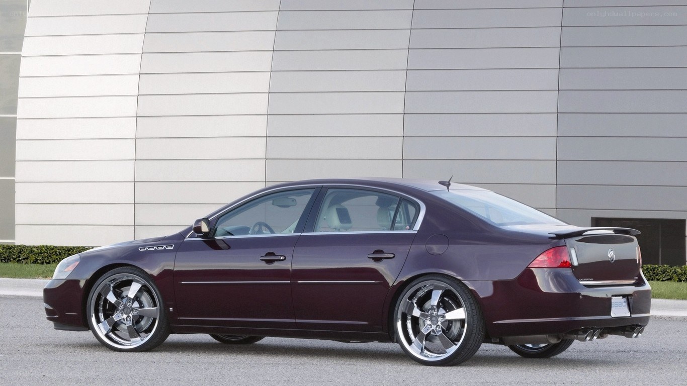 maroon sedan with custom wheels