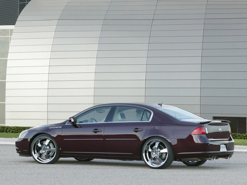 Maroon sedan with custom wheels