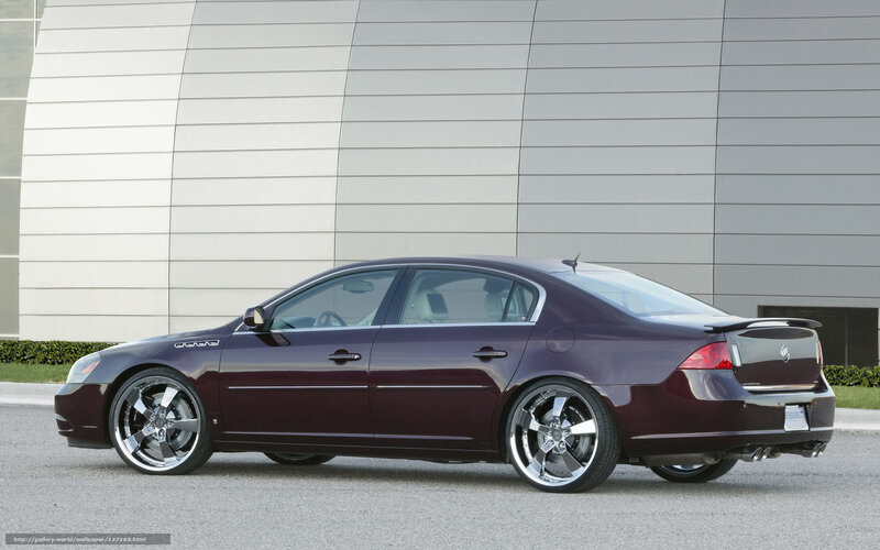 maroon sedan with custom wheels