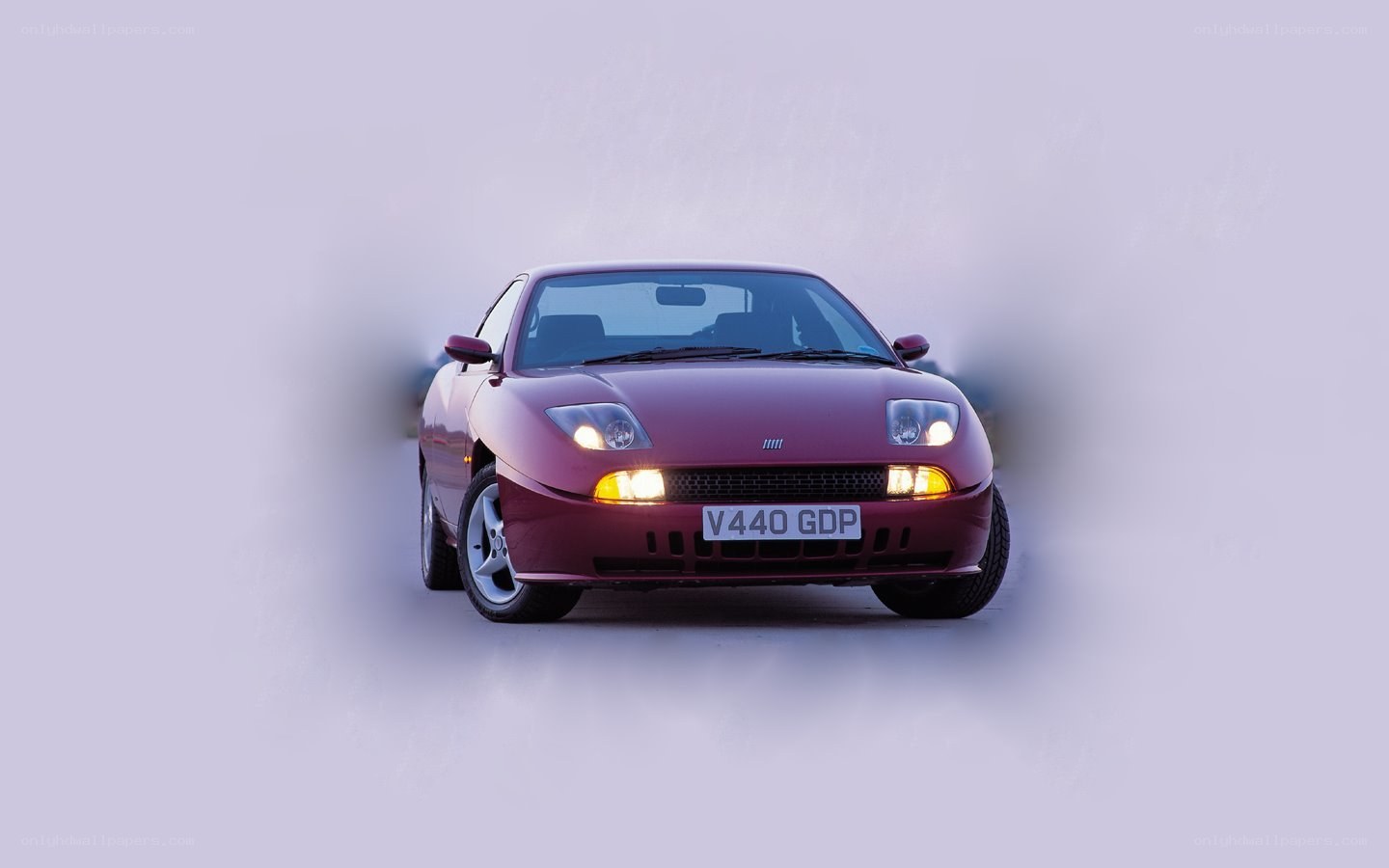 maroon sports car front view