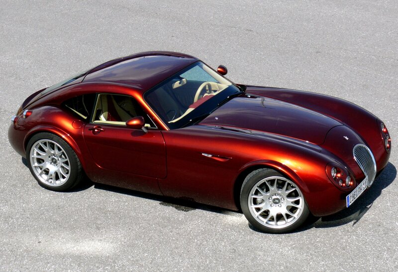 maroon sports car on pavement