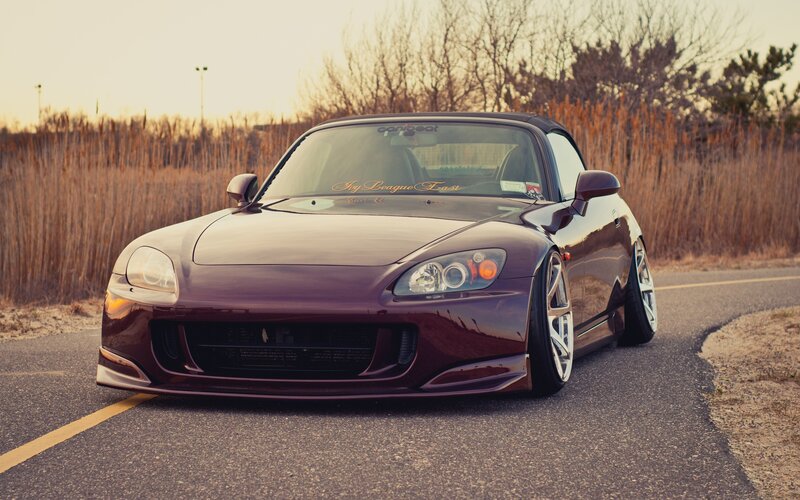 maroon sports car on road