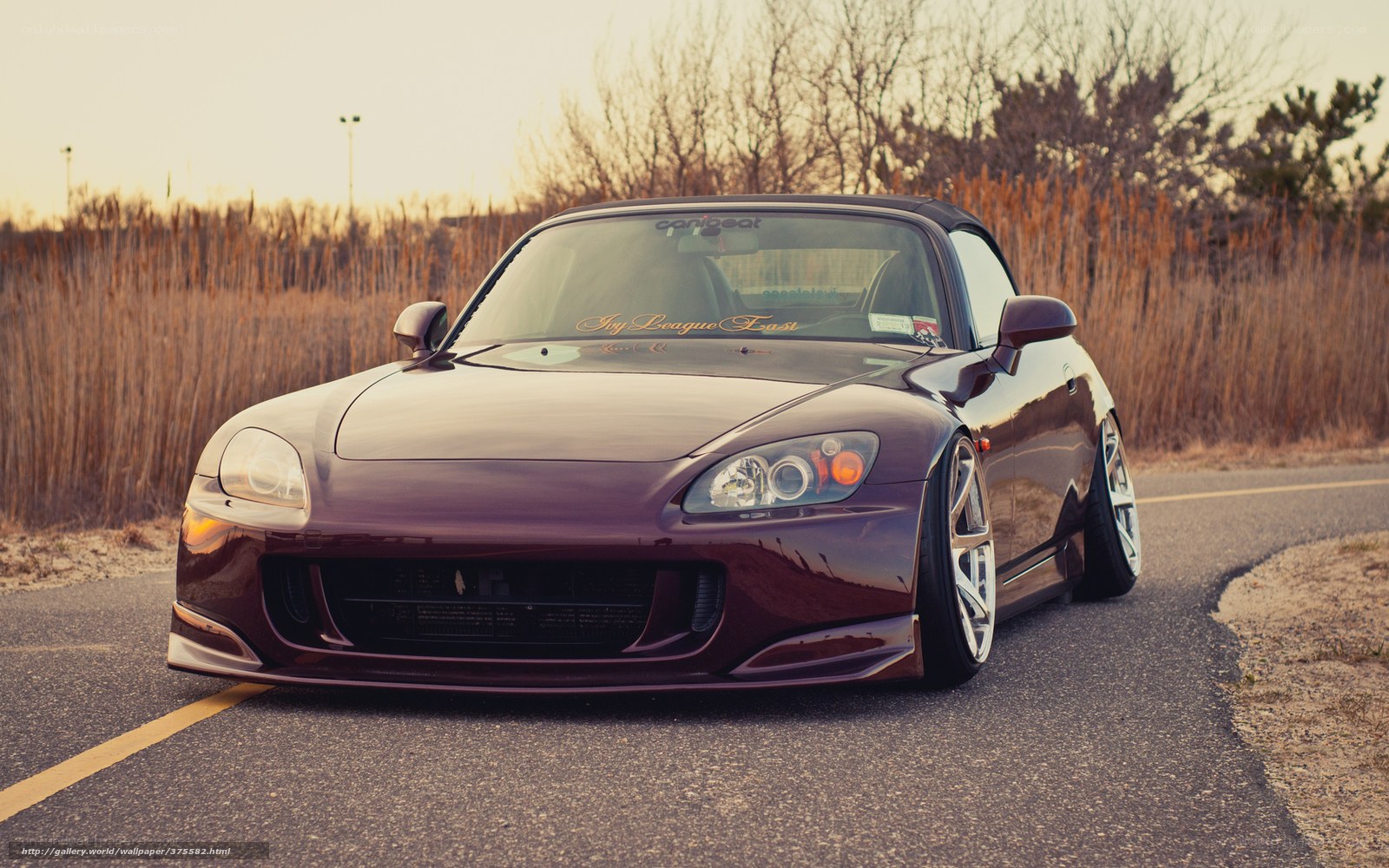 maroon sports car on road
