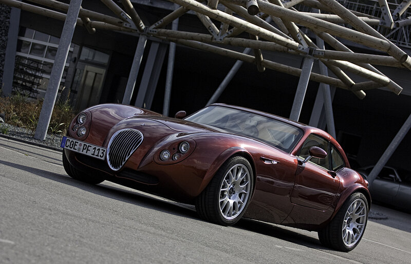 Maroon sports car on street