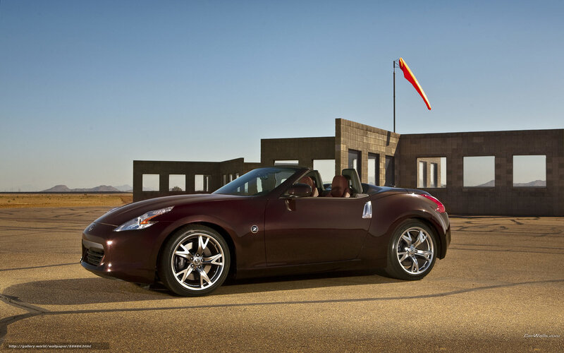 Maroon sports car on tarmac