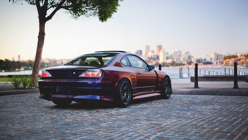 Maroon Sports Car — Serene, Sunset