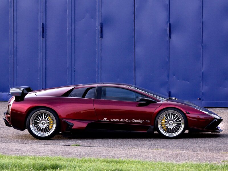 Maroon sports car with custom wheels
