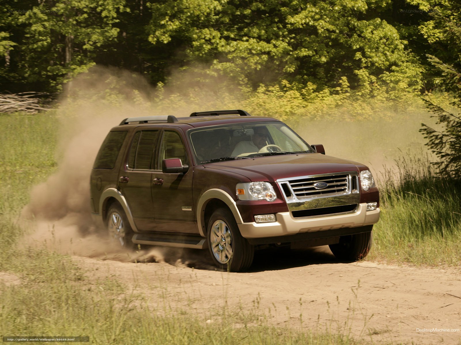 Maroon SUV on dirt road