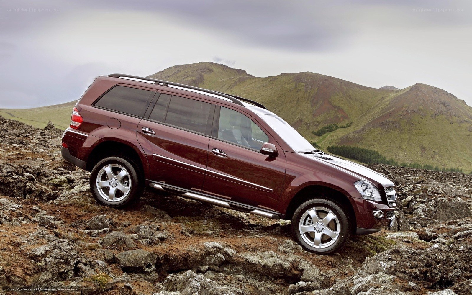 Maroon SUV on rocky terrain
