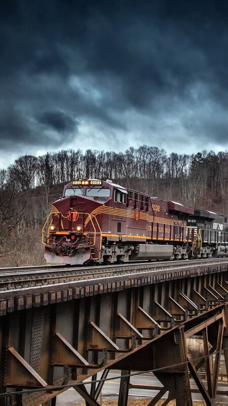 Maroon Train on Bridge — Dramatic