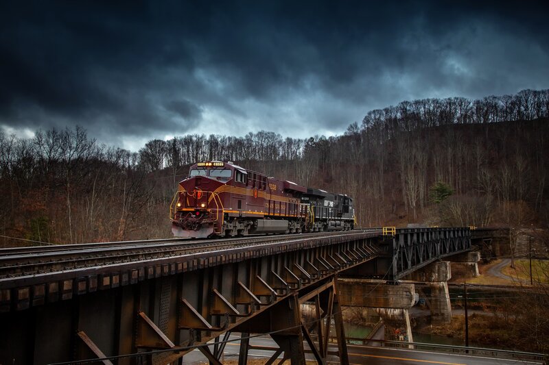 Maroon Train on Bridge