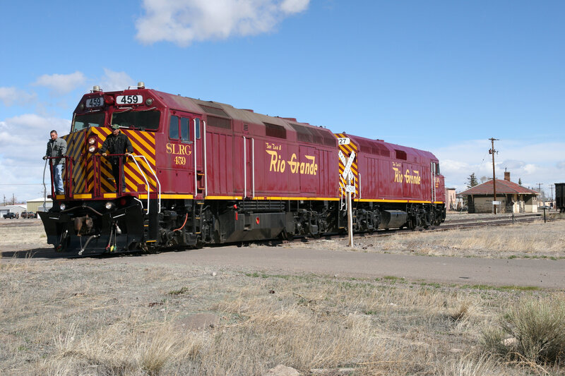 Maroon Train on Tracks — Red