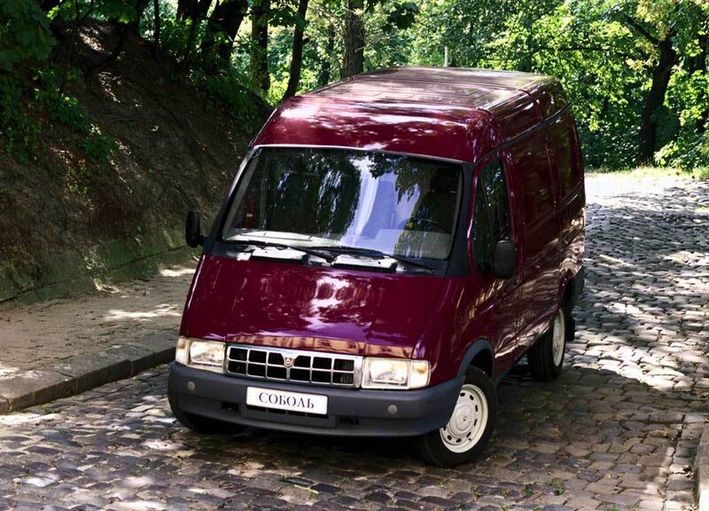 Maroon van on cobblestone street