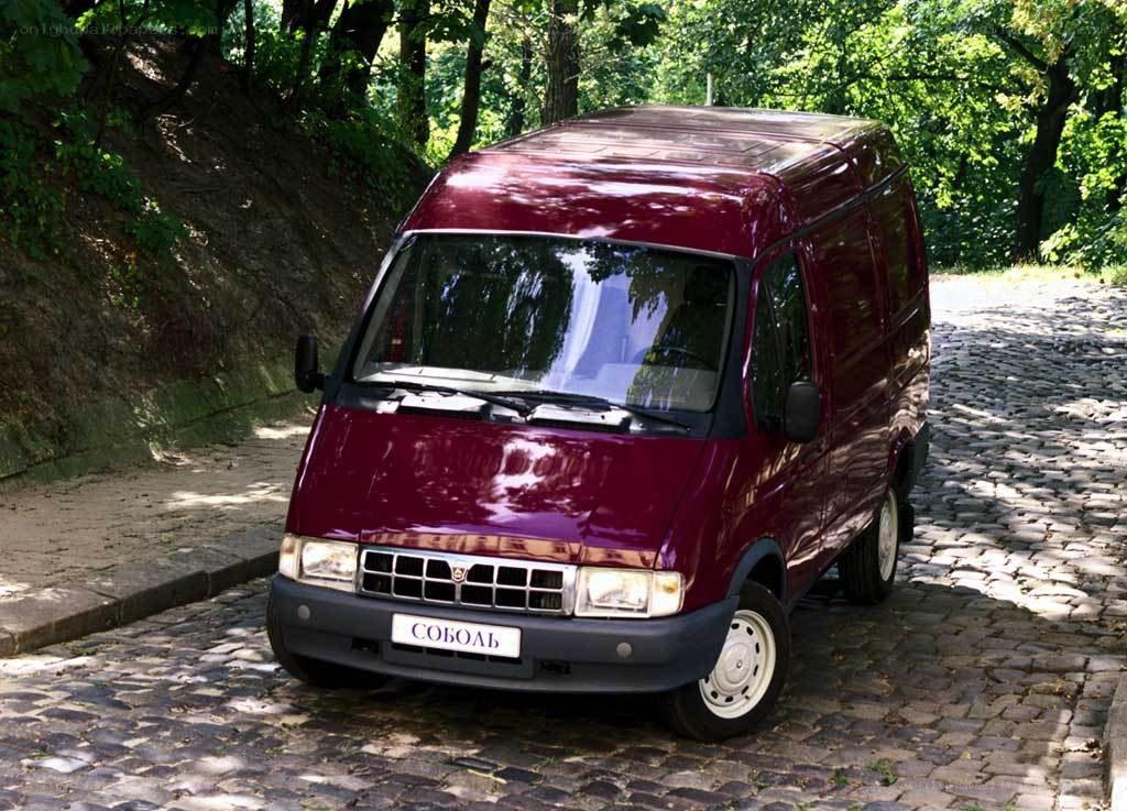 Maroon van on cobblestone street
