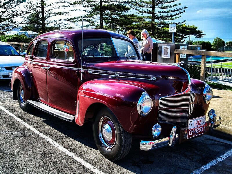 Maroon vintage car at a show