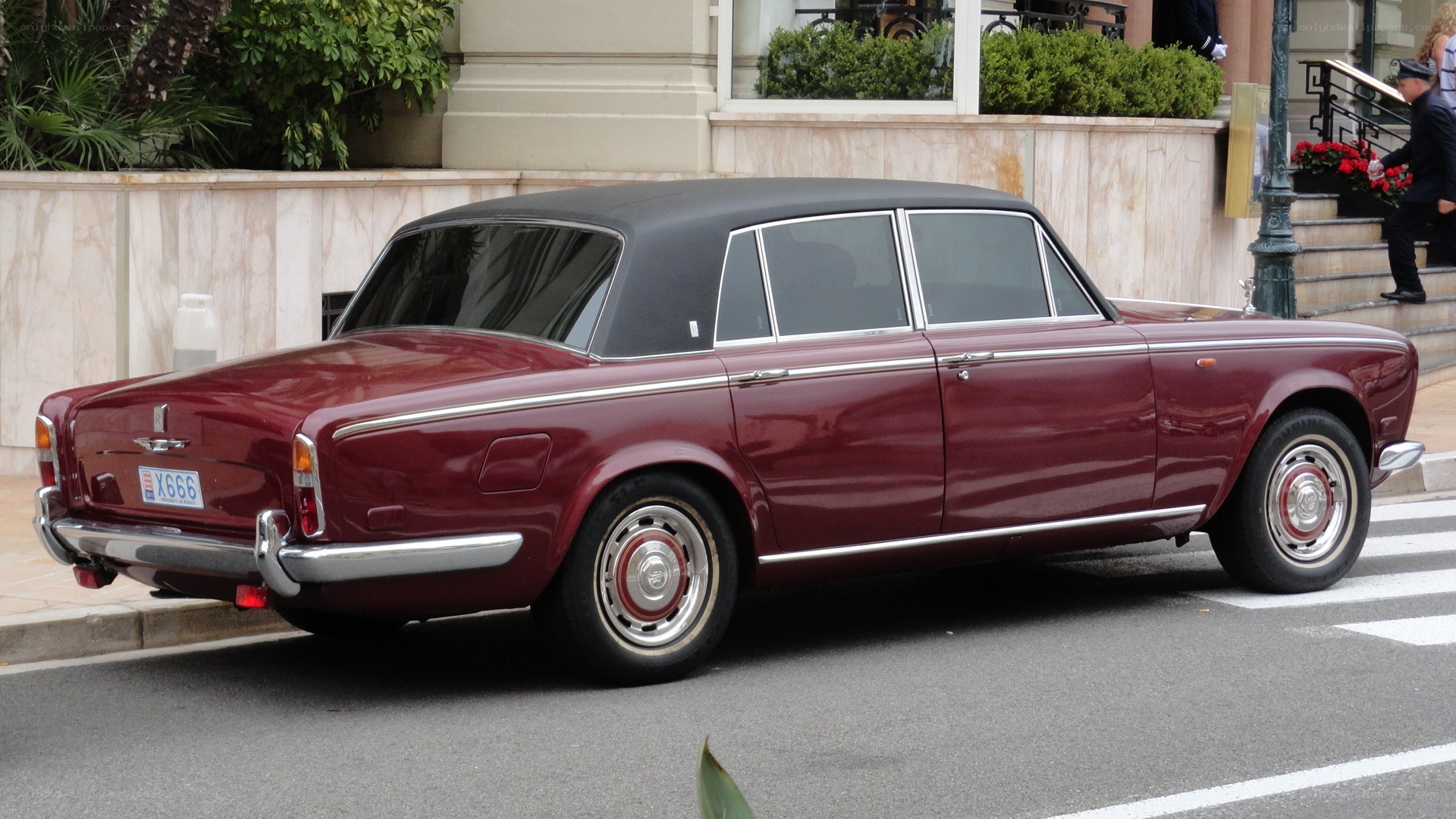 maroon vintage car on street