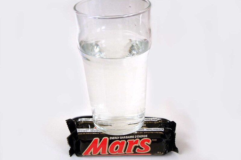 Mars bar with glass of water