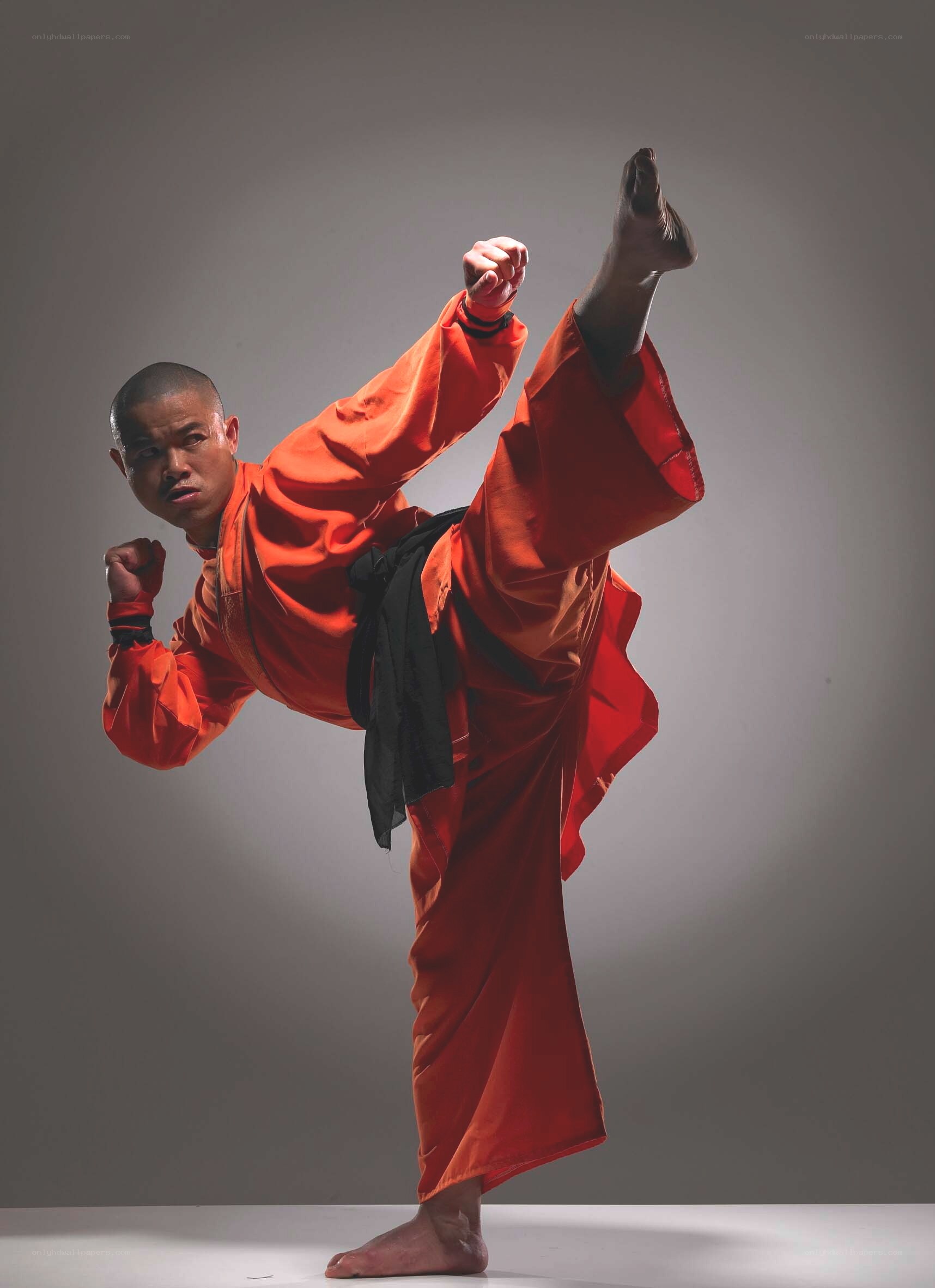 martial artist in orange uniform