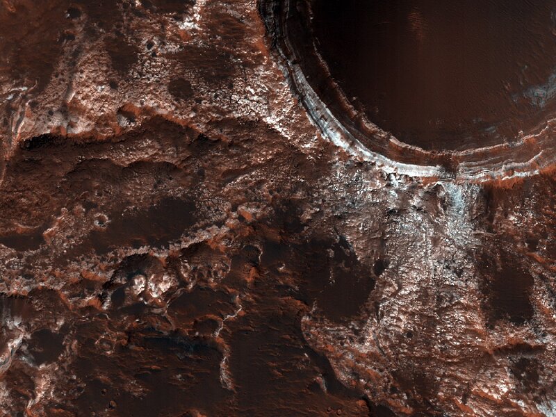 Martian surface with crater