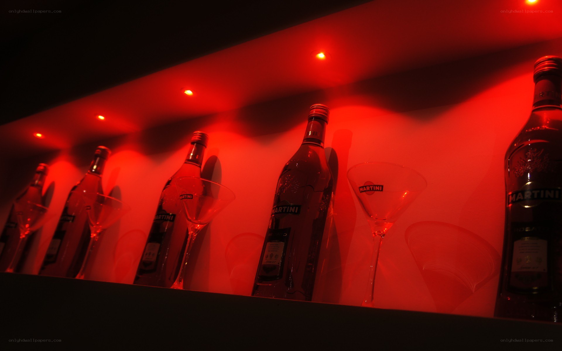 Martini bottles in red light