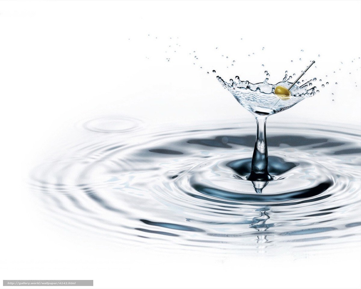 martini glass with olive splash