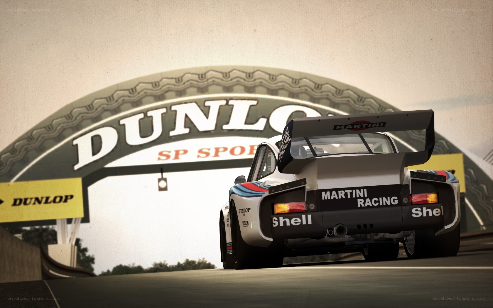 Martini Porsche on racetrack