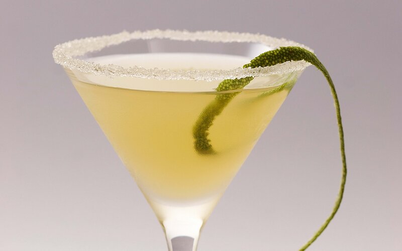 martini with lime garnish