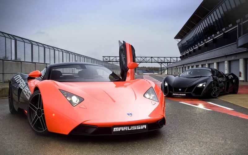 Marussia sports cars on a racetrack