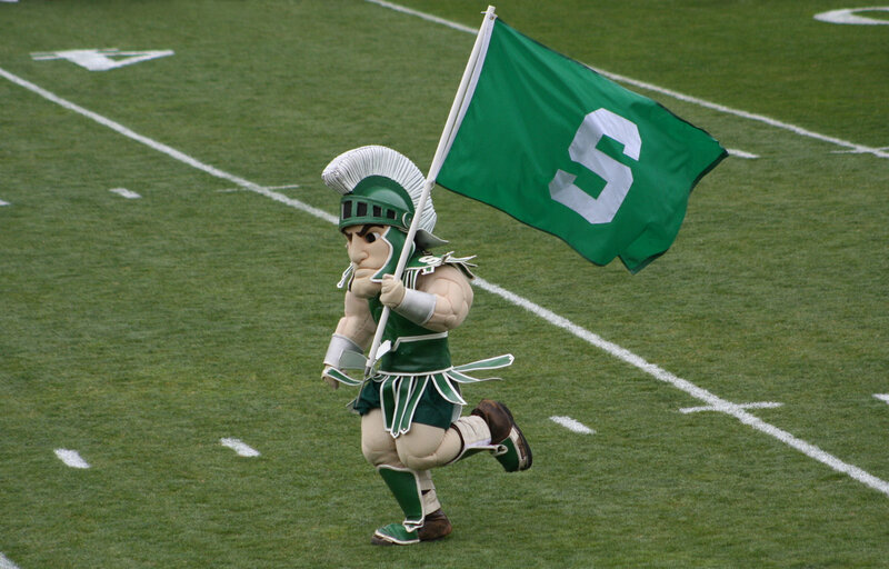 Mascot Holding Flag