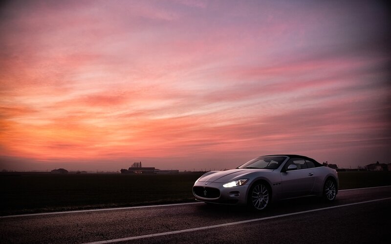Maserati at sunset on a country road
