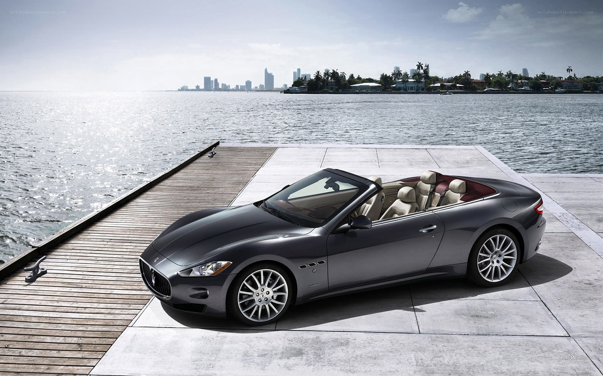 Maserati convertible on a dock